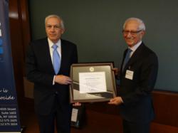AIPR President Fred Schwartz presents the Raphael Lemkin Genocide Prevention Prize to Gen. Wesley Clark